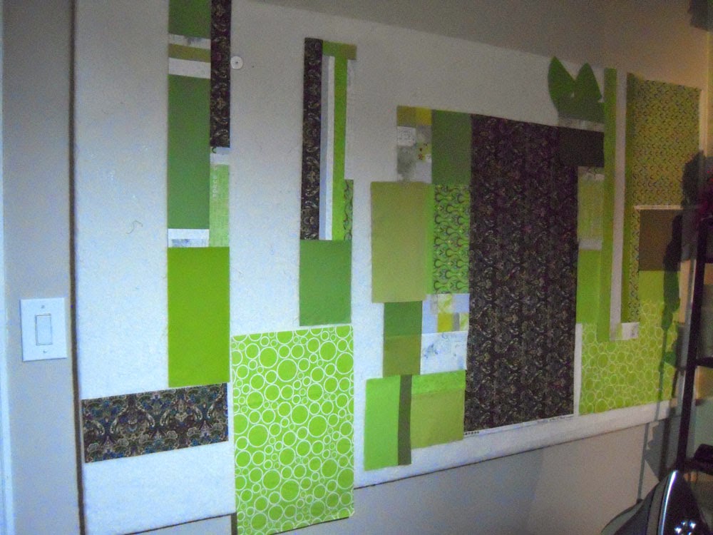green fabrics on design wall