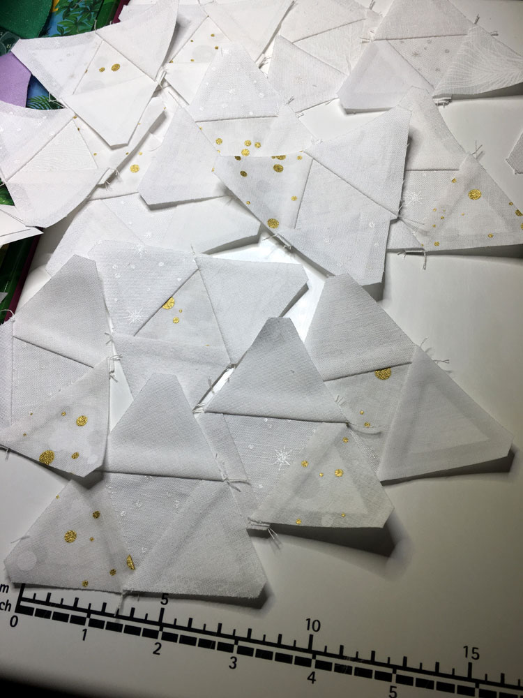Bright white small triangles sewn into larger ones.