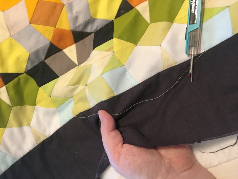 Quilt Fix: Un-quilting one straight line, and un-basting to get to the problem area