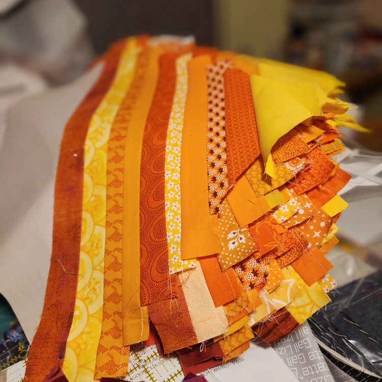 String Quilt: Orange and yellow strips