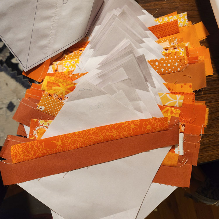 String Quilt: Orange strips on 6" blocks