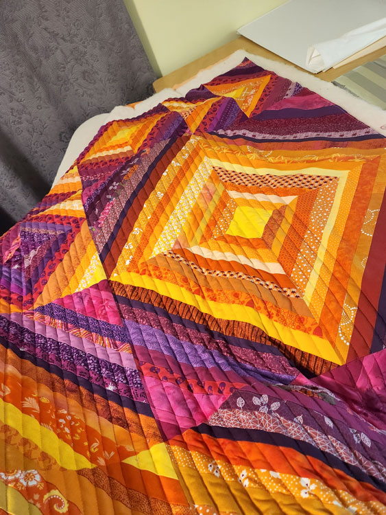 Quilting on a string quilt